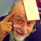 Arthur Fry, inventor of the Post-it Note, with one on his forehead bearing a with a picture of a lightbulb.